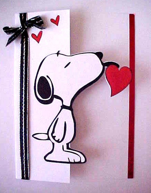 a greeting card with a snoopy cartoon character holding a red heart on it's side