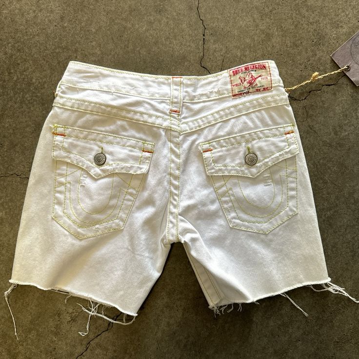 Deadstock Y2k Womens True Religion Jorts. Made In Usa Size 27. White Denim. 6” Length Tags Trues Vintage 90s 80s 70s Y2k Y2k Highwaisted Low Rise Lowrise Pins Patches Levis Cute Cool Baggy Jnco If You're Ever In The La Area Please Stop By The Store. @Southbayvintagela On Instagram And Tiktok For More Info! Y2k Shorts With Pockets For Summer, Y2k Style Shorts With Pockets For Summer, White Y2k Bottoms For Summer, Y2k Style Summer Shorts With Pockets, Y2k Cotton Bottoms With Frayed Hem, Y2k Style Bottoms With Built-in Shorts, Y2k Mid-rise Shorts With Pockets, Y2k Style Cotton Shorts For Spring, Spring Y2k Style Cotton Shorts