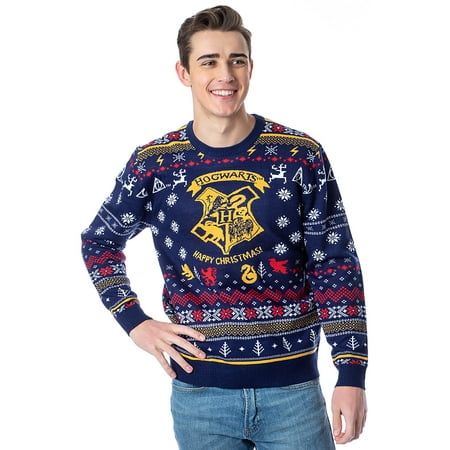 a young man in a harry potter christmas sweater posing for the camera with his hands on his hips