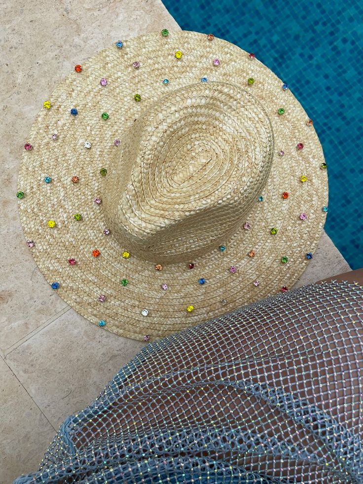 Ladies, our newest brand of straw hats is from Europe! Carried in stores like Love Shack Fancy & Harrods, we thrilled to bring them to GB! The Roma Crystal straw hat offers a luxurious and stylish look, crafted by hand with natural straw and glistening crystal embellishments. Perfect for adding a touch of glamour to any outfit. 10cm brim 57-59cm circumference, adjustable. Hand studded pearl embellishment Handmade in the UK Luxury Beach Sun Hat For Spring, Luxury Beach Hats For Summer, Luxury Summer Beach Hat, Luxury Summer Beach Fedora, Summer Party Hats Embellished, Summer Party Embellished Hats, Summer Party Straw Hat With Short Brim, Summer Hats With Rhinestones And Short Brim, Party Fedora Hat In Straw