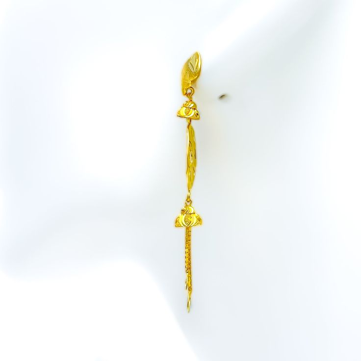 These 22k gold earrings, weighing 5.2 grams, feature a blooming design with a dual finish. The intricate detailing in yellow gold creates a vibrant and dynamic look. Each earring is 2.3 inches long and crafted in a hanging style, offering an elegant drape. The screw-back posts ensure these earrings remain securely in place, perfect for adding a touch of floral elegance and sophistication to any outfit. PRODUCT DETAILS Gold Purity(karat): 22k Gold Weight(grams): 5.2 Item Finish: Yellow Gold Earri 22k Gold Earrings, Elegant Drapes, 22k Gold, Gold Earrings, Screw, Yellow Gold, Yellow, Floral, Gold