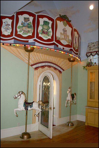 a merry go round with lights and decorations on the top is shown in this room