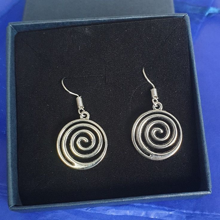 Spiral earrings earrings  You can choose from sterling silver or silver plated  Comes wrapped in tissue paper and organza bag, wrapping upgrades available from the Add on section of my shop or the checkout (bags and boxes). If you'd like a free personalised message on a gift tag, please leave me your message. Gifts For Her Birthday, Spiral Earrings, Silver Gifts, Organza Bags, Star Earrings, Gift Tag, Earrings Silver, Tissue Paper, Post Earrings