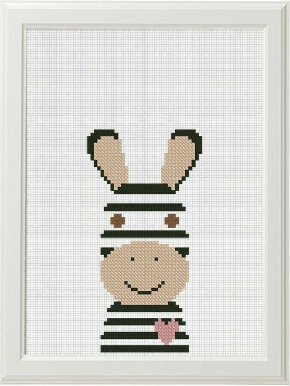 a cross stitch pattern of a rabbit wearing a hat and striped shirt, with the words happy