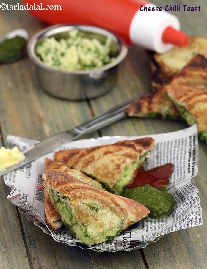 grilled cheese and pesto sandwiches on a wooden table