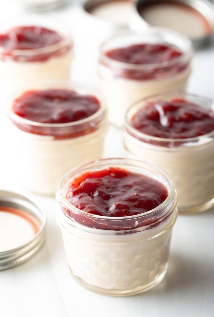 small jars filled with food sitting on top of a table