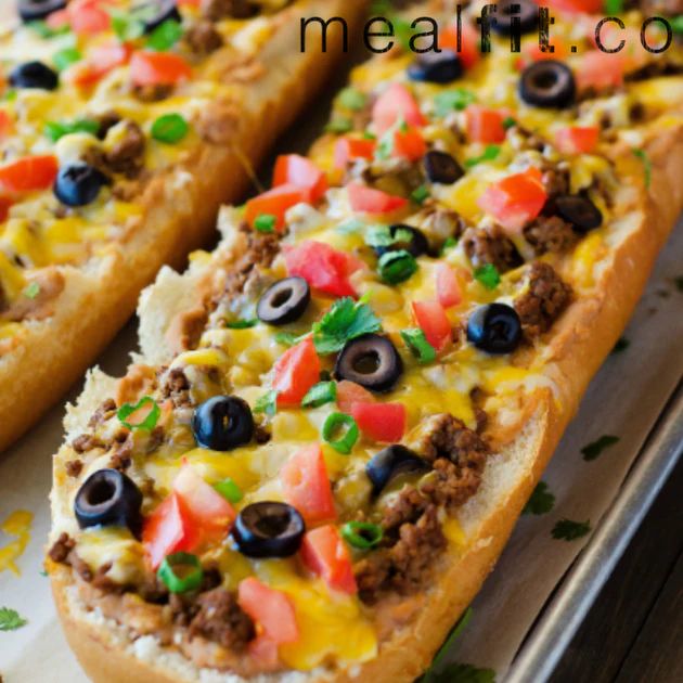 two slices of bread with cheese, black olives and meat on it sitting on a plate