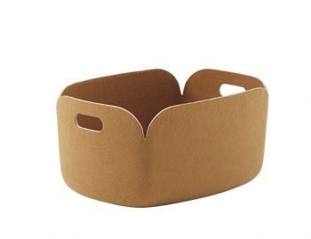 a brown paper container with two handles on the bottom and one in the middle, sitting on