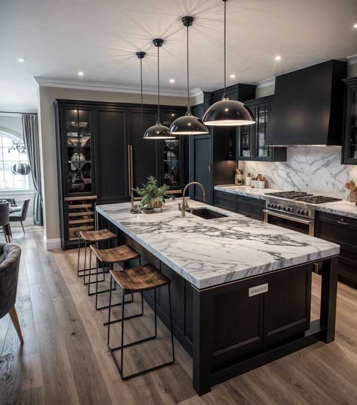 a large kitchen with marble counter tops and black cabinets, along with bar stools