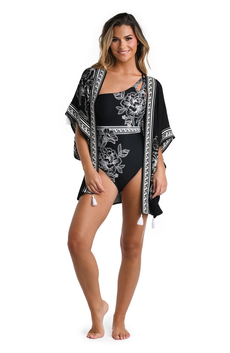 This lightweight cover-up is highlighted by a border print and fringed tassels for a style that's ready for a sunny getaway. Open front Elbow-length sleeves 100% viscose Hand wash, line dry Imported Black Bohemian Cover-up For Pool, Bohemian Black Cover-up For Pool, Black Bohemian Pool Cover-up, Bohemian Black Pool Cover-up, Spring Vacation Swimwear With Tassels, Spring Beach Cover-up Swimwear With Tassels, Spring Beachwear With Tassels, Black Fringe Beachwear Cover-up, Spring Fringe Swimwear For Poolside