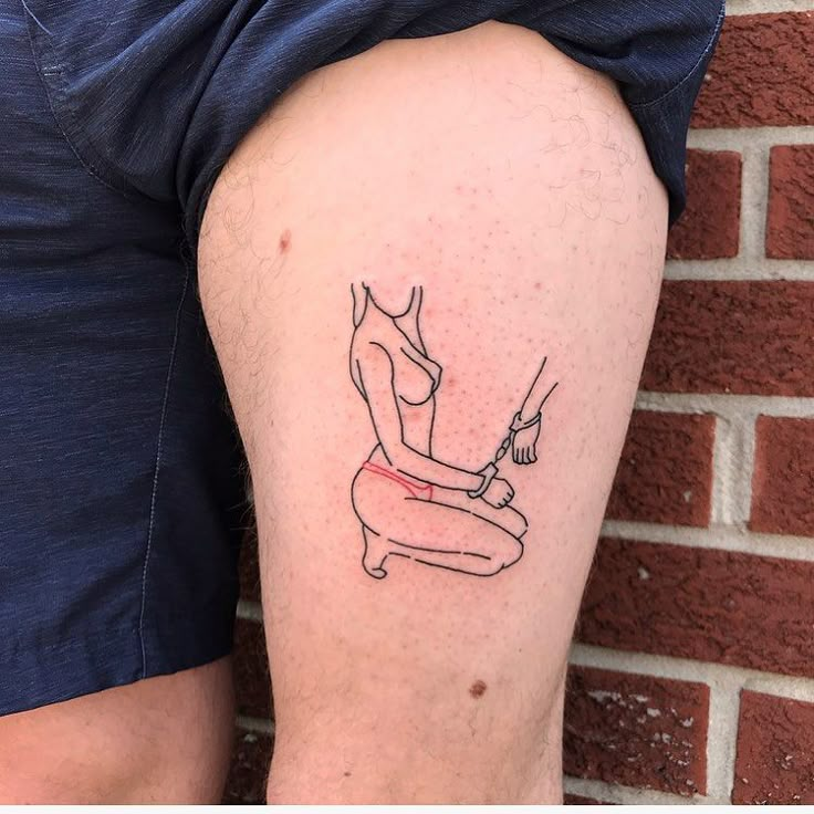 a person with a tattoo on their leg