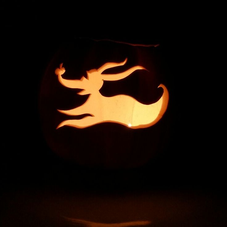 a carved pumpkin with an animal on it