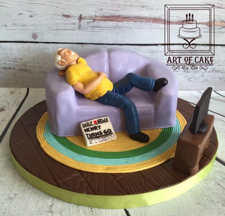 a cake made to look like a man laying on a couch