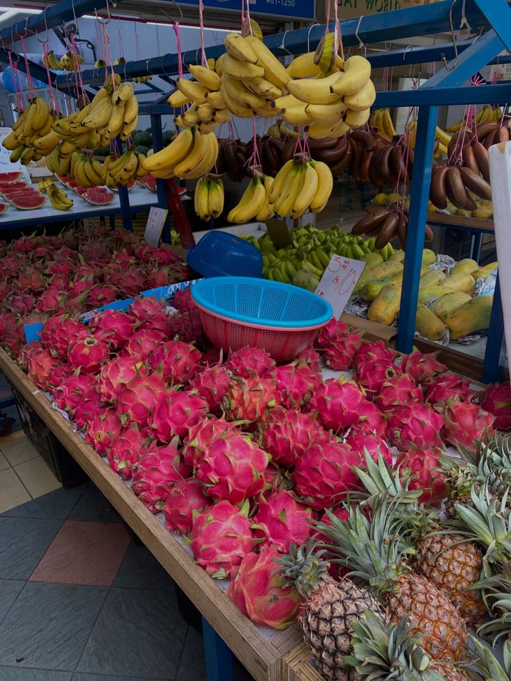 various fruits and vegetables are on display at a market