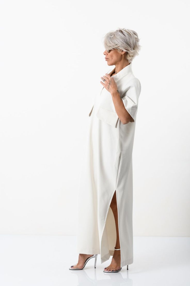 Elegant V-neck Relaxed Fit Shirt Dress, Elegant White Longline Dresses, Daywear Longline Maxi Dress, Chic Long Dresses With Side Slits, Chic Long Shift Dress, Elegant Shift Maxi Dress With Short Sleeves, Elegant Short Sleeve Maxi Dress With Side Slits, White Long Dress For Work, Long White Dress For Work