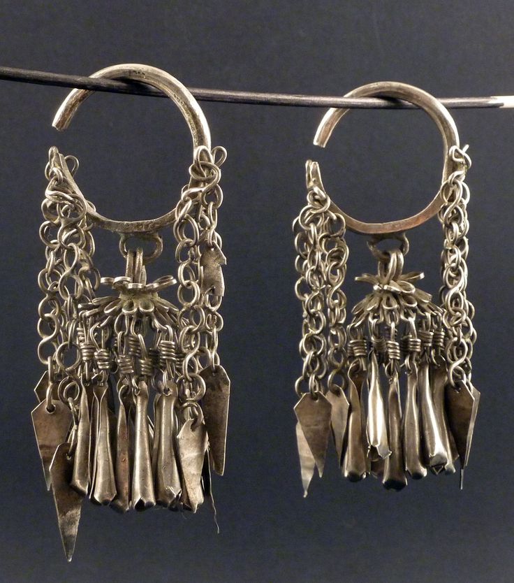 Old Chinese silver earrings, with chains and dangles. Tested as high-grade silver, +800/1000. From the early XXth Century. The earrings measure 9 cm long (3,54 in). The gauge of the silver wire that goes through the earlobe hole is 4 mm. Both of them weigh 87 gr. (SEA202) If sold outside the EU, the buyer is responsible for paying import duties. Shipping: items purchased are ready for shipping in maximum 1-2 days, if not told otherwise. As a regular rule, items under 150 euros are shipped by reg Antique Silver Plug Earrings, Heavy Silver Bohemian Earrings, Traditional Silver Chandelier Earrings For Ceremonial Occasions, Silver Chandelier Earrings With Dangling Beads For Festivals, Vintage Silver Chandelier Earrings With Latkans, Ornate Silver Chandelier Earrings For Festivals, Ornate Silver Danglers With Latkans, Traditional Silver Dangle Chandelier Earrings, Bohemian Heavy Earrings For Ceremonial Occasions