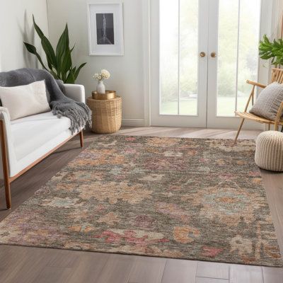 a living room filled with furniture and a rug