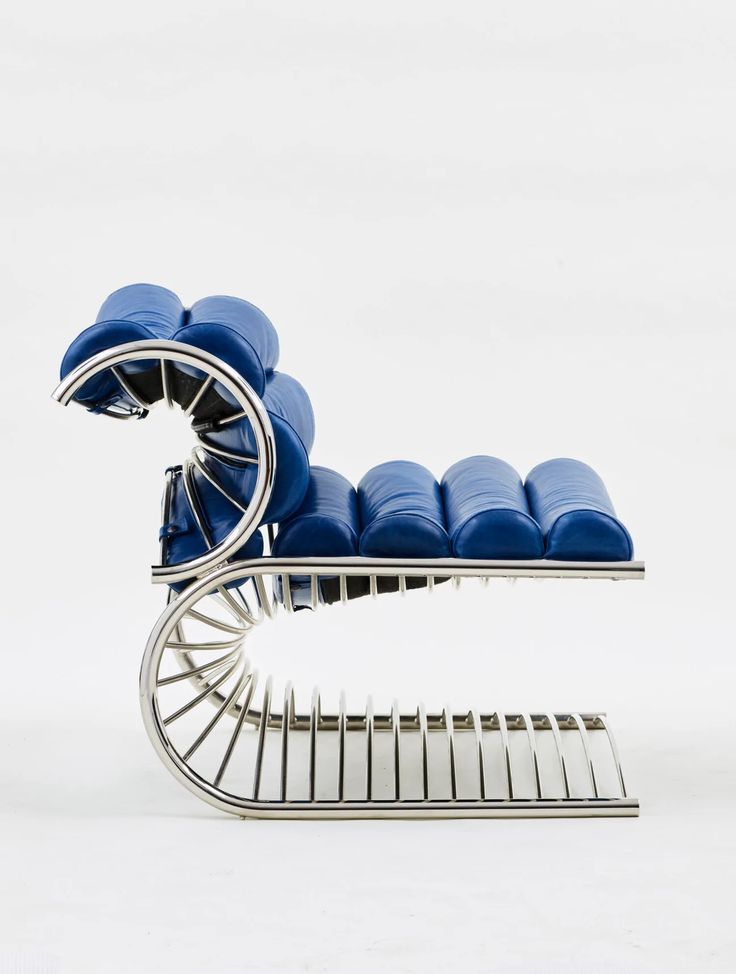 a chair with blue cushions sitting on top of it