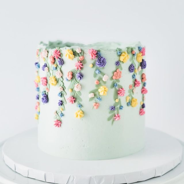 a white cake with colorful flowers on it