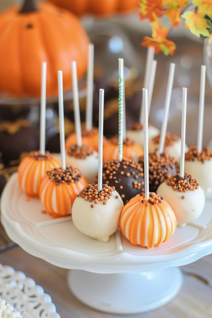 cake pops are arranged on a white plate