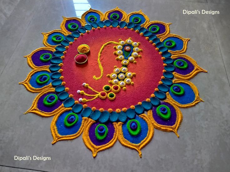 a colorful rangdi with peacocks and beads on the floor