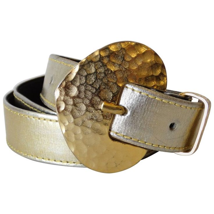 Elevate your outfit with this Yves Saint Laurent belt from the 1980s! Gold metallic leather belt with gold hammered belt-buckle. Marked a size medium. Measures 34 inches total. Yves Saint Laurent Belt, Belts 2023, Saint Laurent Belt, Stone Gold, The 1980s, Multi Stone, Metallic Leather, Metal Buckles, Belt Buckle