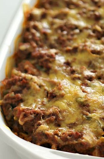 a casserole dish filled with meat and cheese