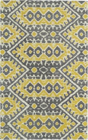 an area rug with yellow and gray designs