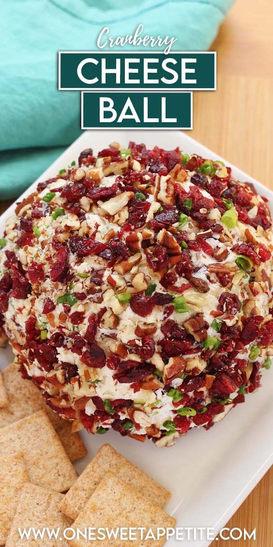 a cheese ball on a plate with crackers