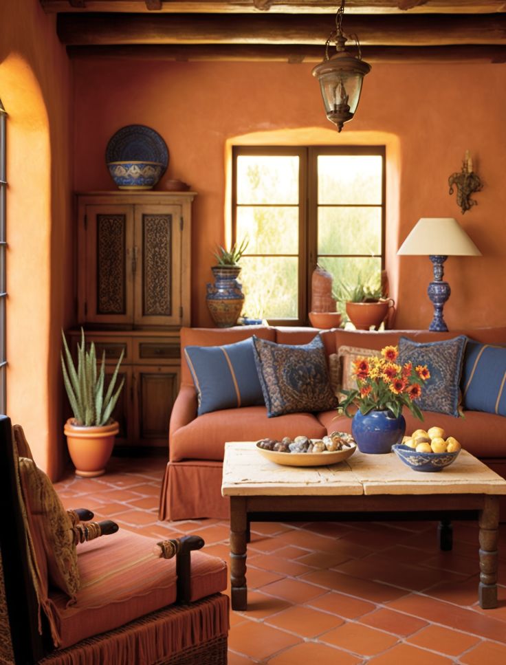 a living room filled with lots of furniture and flowers on top of a coffee table