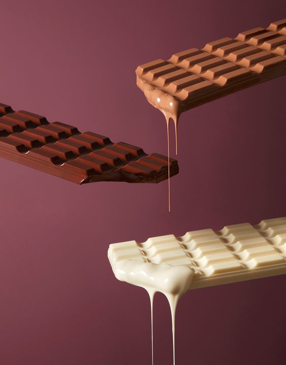 the chocolate bar is dripping from it's top and bottom, along with another one that appears to be melting