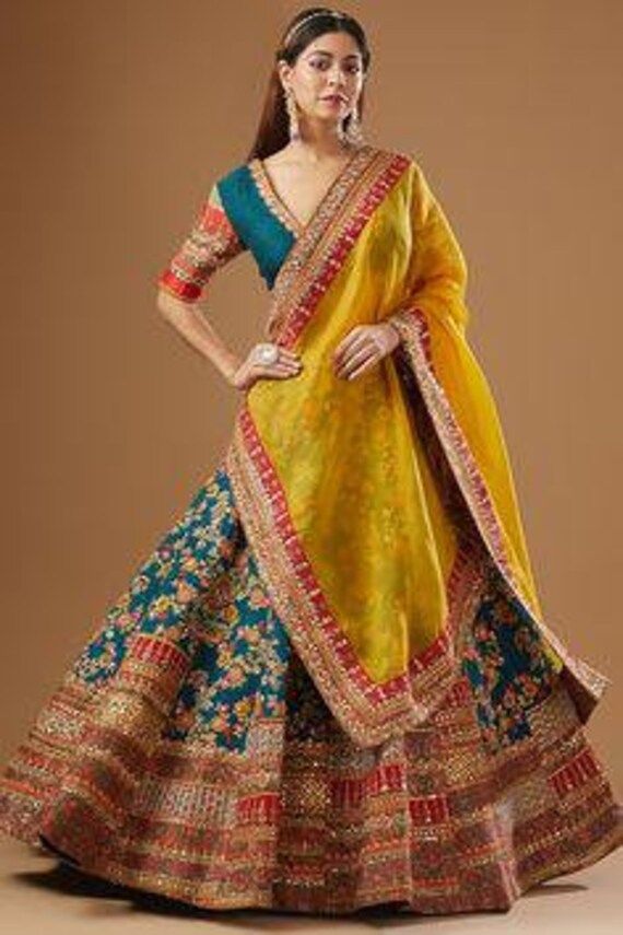 Create your special look more effectively enrobing this beautiful yellow mirror work lehenga choli  Lehenga(Semi-Stitched) Lehenga Fabric : Georgette  Lehenga Work : Thread and Paper Mirror Work  Lehenga waist : Support Up To 42 (With Metal Belt) Stitching : Stitched With Canvas Length : 41  Flair : 3.5 Meter Inner : Micro cotton Dupatta Dupatta Fabric : Georgette  Dupatta Work : Thread and Paper Mirror Work Dupatta Length : 2.5 Meter Blouse(Unstitched) Blouse Fabric : Georgette Blouse work : Th Gujrati Lehnga Design, Indian Outfits Lehenga Modern, Bridal Lehenga 2024, Lahanga Design Latest, Traditional Lehenga Designs, India Outfits, Front Mehndi, Choli Design, Engagement Dress For Bride