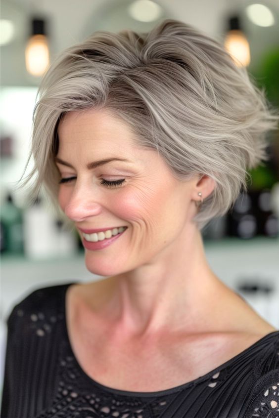 This short hairstyle is a testament to the beauty of embracing your natural silver hues. With its dynamic layers and texture, this short bob is both edgy and chic. Click here to see more stunning hairstyles for women over 40. Edgy Short Bobs For Women, Short Bob Grey Hair, Shirt Haircuts For Women Over 50, Classic Bob Haircut, Layered Bob Short, Gorgeous Hairstyles, Stunning Hairstyles, Vlasové Trendy, Classic Hairstyles