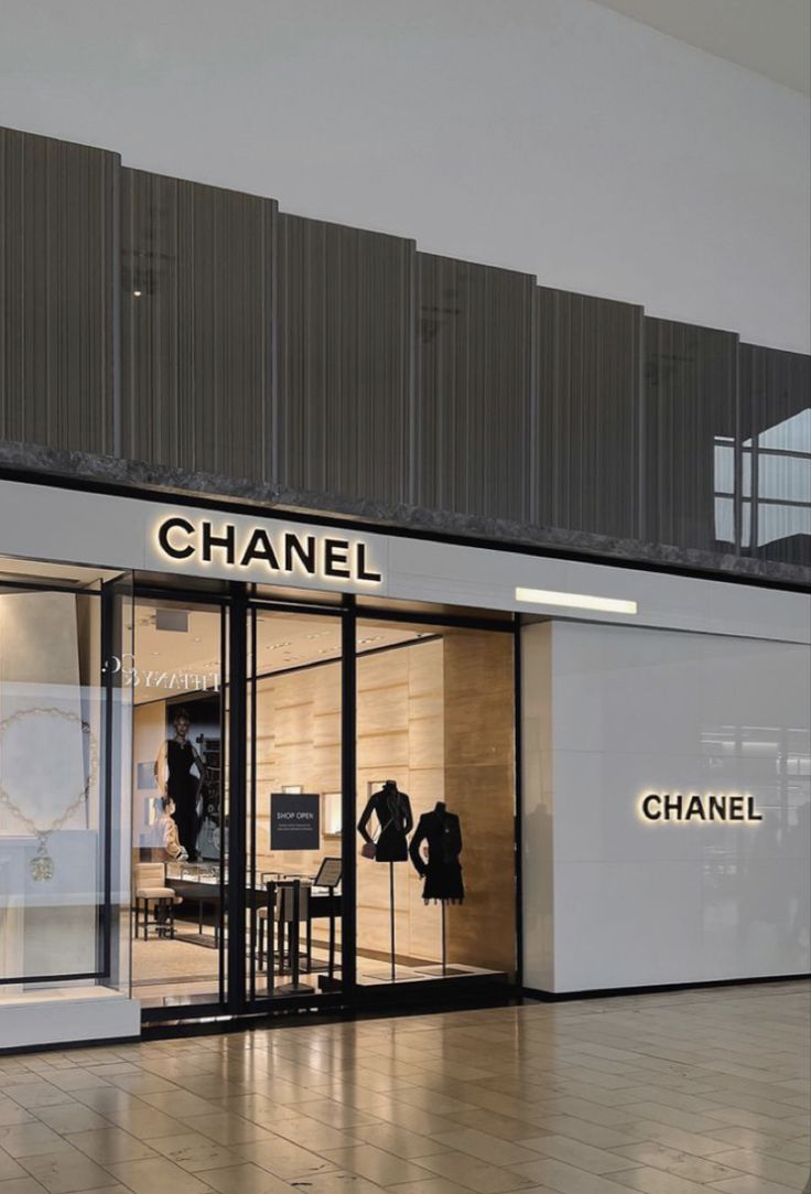 a chanel store front with its glass doors open