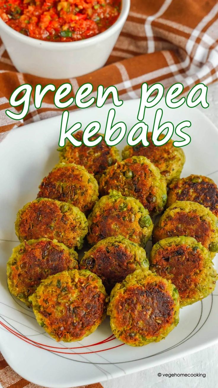 green pea kebabs on a white plate next to a bowl of red peppers