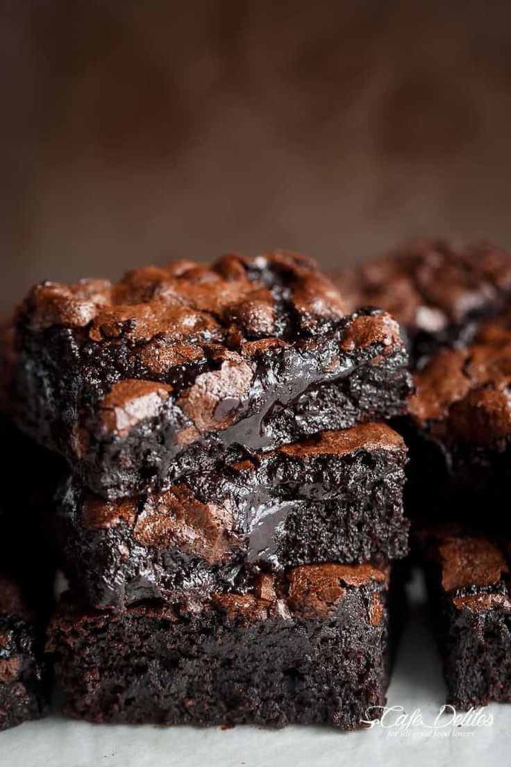 chocolate brownies stacked on top of each other