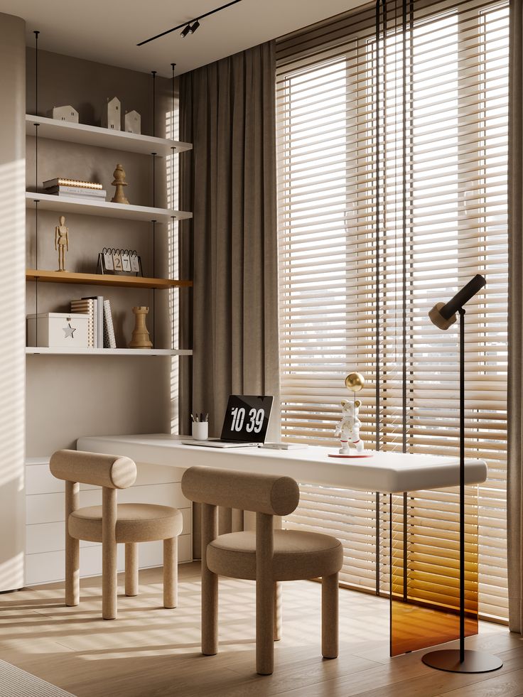 a white table with two chairs and a lamp in front of it, next to a bookshelf