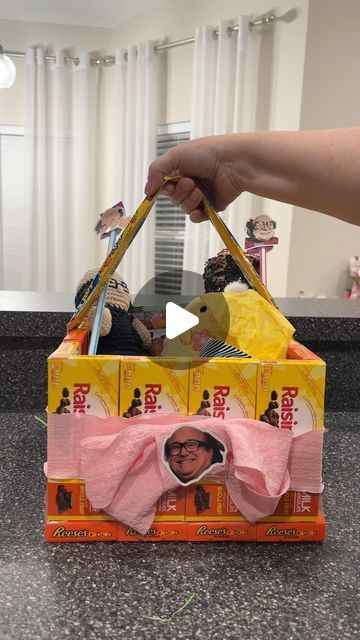 someone is holding a bag with an image on it