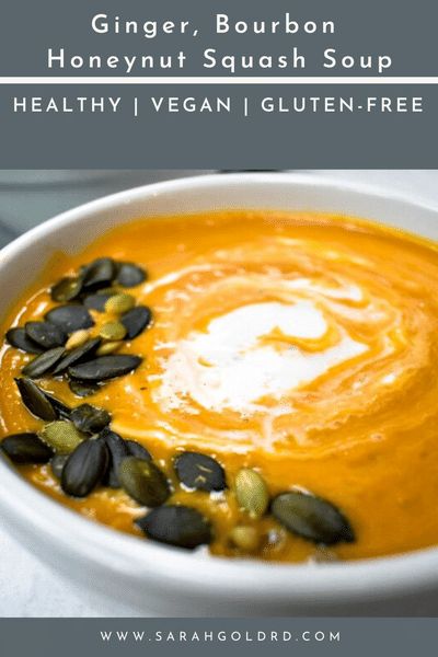 a white bowl filled with carrot soup and topped with sunflower seeds, in front of a text overlay that reads ginger, bourbon honeynut squash soup