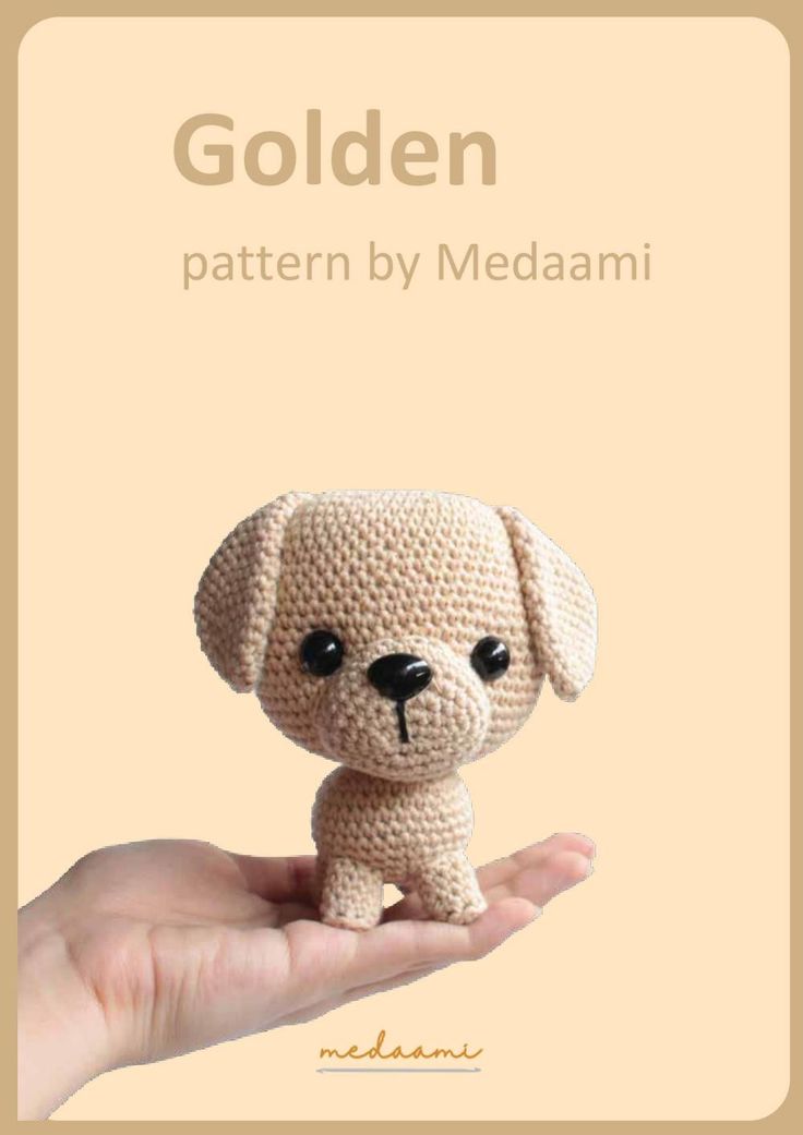 a small crocheted dog sitting on top of a persons hand with the title golden pattern by medaami