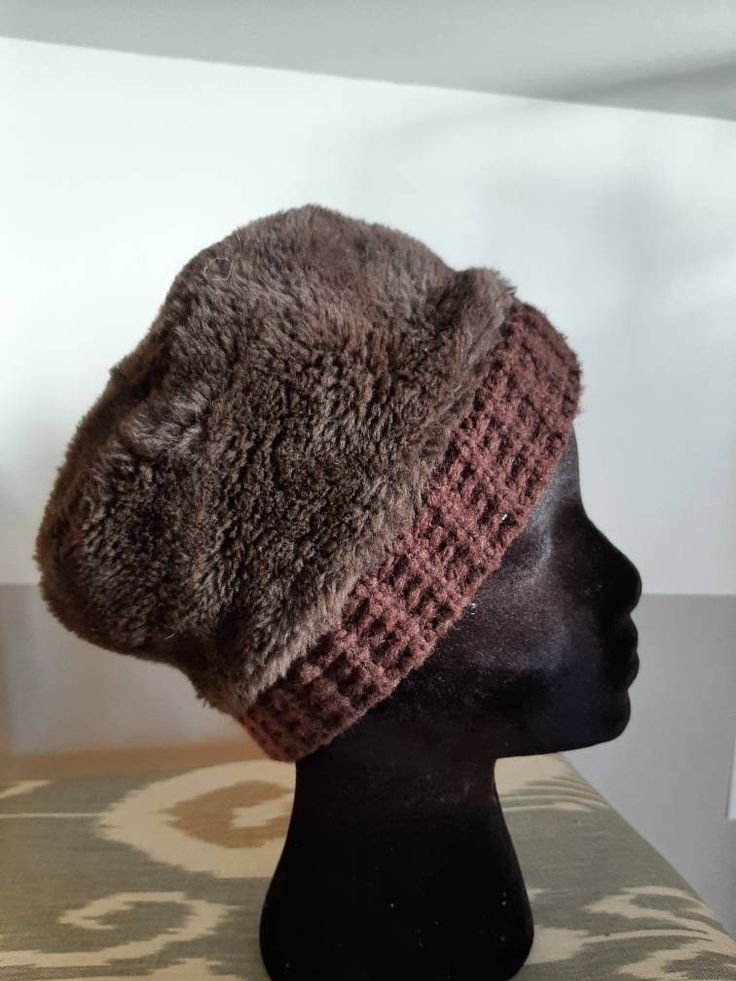 Adorable vintage brown faux mens or womans winter beanie hat. Perfect shape for age Has a crochet brown band at base of hat. No manufacturer noted. 21 1/2 inches around base but very stretchy. Adjustable Brown Hats With Faux Fur Lining, Adjustable Brown Hat With Fleece Lining, Fitted Winter Bonnet Cap, Fitted Crochet Winter Hat, Winter Brimmed Bonnet, Winter Fitted Beanie Bonnet, Brown Hats With Fleece Lining For Cold Weather, Winter Brimmed Fitted Bonnet, Winter Fitted Bonnet Beanie