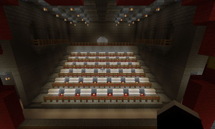 an empty auditorium with rows of seats and lights on the walls, in a minecraft style setting