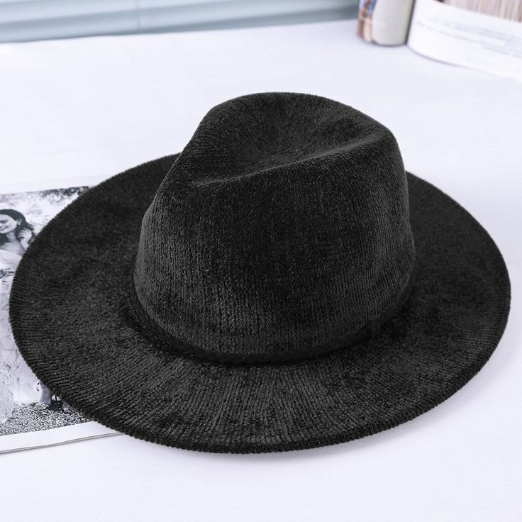 The EMES SHOP hat is detailed with minimalist slim braid trim. Features a woven material. small metallic tag detail. and fedora hat design.MATERIAL:100% Brushed Wool BlendCIRCUMFERENCE MEASUREMENTS: 56-58cm 22-23in Skeleton Hat, Wide Brim Bucket Hat, Woven Hat, Womens Fedora, Bucket Hat Women, Trilby Hat, Velvet Hat, Wool Fedora, Hat Women