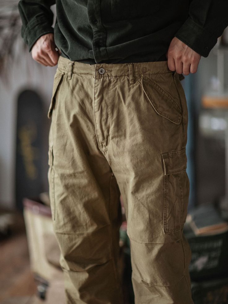 Offering timeless wardrobe staples. Steeped in timeless Americana and rugged style, these cargo pants are utilitarian inspired. Crafted from durable cotton canvas they feature multiple pockets for storing the essentials. For a rugged and well-worn appearance, a stone wash completes the design. FEATURES Regular fit with a standard rise. Belt loops. Side adjusters. Zip-fly with a buttoned closure. Two front snapped pockets. Snapped cargo pocket on each leg. Two back snapped pockets. 100% cotton. M Utilitarian Design, Denim Overalls Shorts, Timeless Wardrobe, Rugged Style, Timeless Wardrobe Staples, Utility Pants, Chino Jeans, Cargo Pocket, Vest Shirt