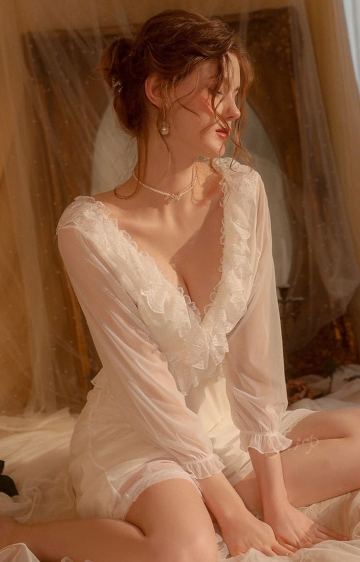 Introducing the Robe du Soir Jeannie, a French-inspired nightgown that exudes elegance and vintage charm. Slip into this luxurious piece and indulge in a taste of luxury, reminiscent of a bygone era. Let the intricate details and French style transport you to a world of sophistication and refinement. Truly a must-have for any discerning individual. How To Wash Bras, Midnight Gown, Wedding Gown Simple Elegant, Enchanted Garden Wedding, Wedding Gown Simple, Honeymoon Gift, Luxurious Hair, Women Hats Fashion, Gown Bridal