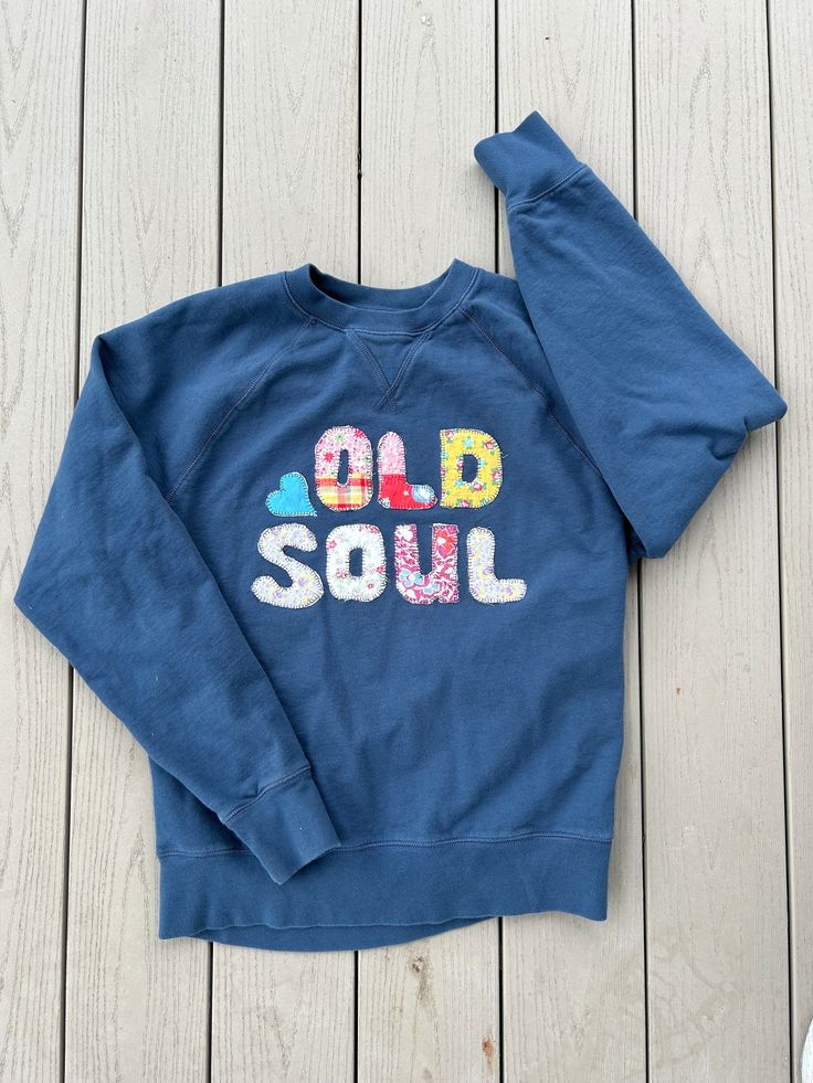 a sweatshirt that says old soul on it