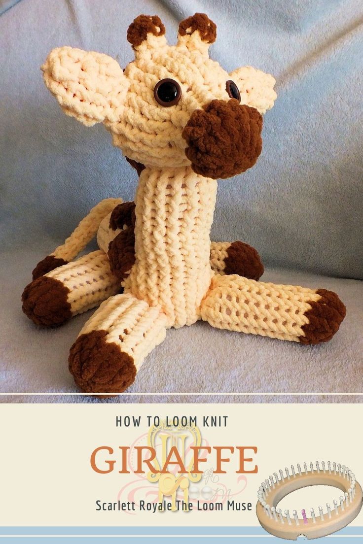 a knitted giraffe sitting on top of a couch