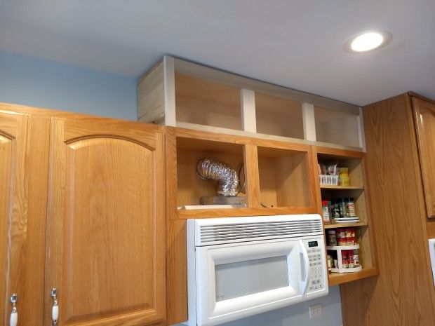 the microwave is built into the cabinets in the kitchen, and it's not too far from the ceiling