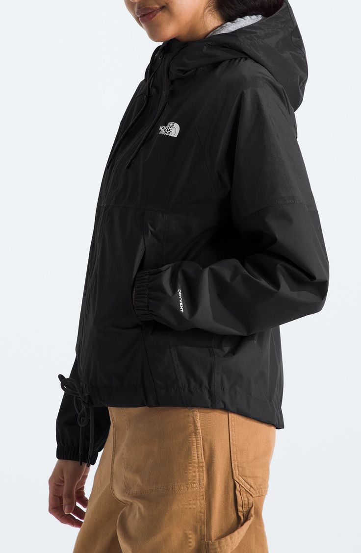 Rainy days have met their match with this hooded jacket that's breathable, lightweight and repels water and wind. 22" length (size Medium) Front zip closure Drawstring hood Stand collar Elastic cuffs Front zip pockets Seam sealed Waterproof PFC-free, durable water-repellent coating is free of per- and poly-fluorinated chemicals, some of which can be harmful to the environment 75-denier 88g/m² DryVent shell with PFC-free water-repellent finish Lined 100% nylon Machine wash, tumble dry Imported Sporty Hooded Jacket With Functional Drawstring For Outdoor, Black Hiking Raincoat With Adjustable Hood, Sporty Hooded Raincoat For Outdoor Activities, Black Sporty Windbreaker For Rainy Weather, Sporty Black Windbreaker For Rainy Weather, Sporty Long Sleeve Hooded Jacket For Rainy Weather, Black Hiking Windbreaker With Drawstring Hood, The North Face Double-lined Hood Outerwear, Black Sports Raincoat With Detachable Hood