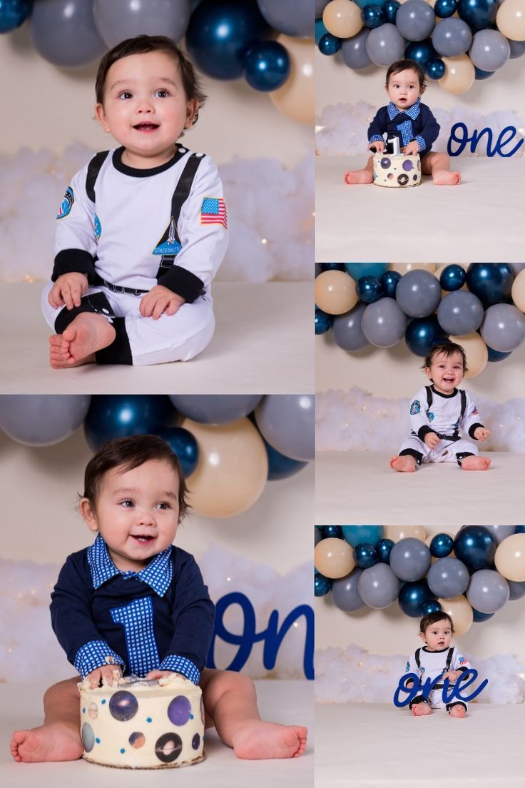 a baby boy sitting in front of balloons and posing for his first birthday cake smash